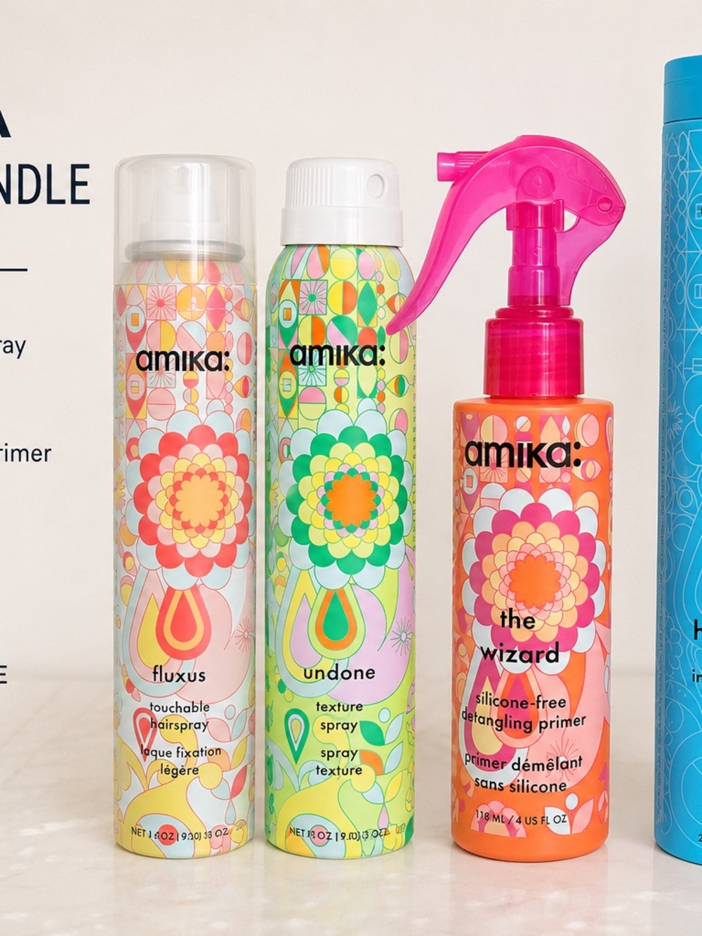 amika Silicone-Free Detangler Primer Spray in Pink and Orange